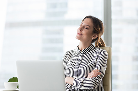 A woman is chilling at her seat with her eyes closed