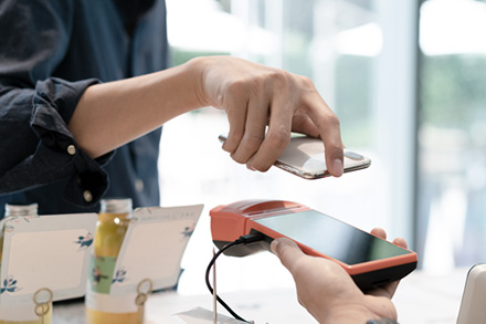 A man is using mobile payment, illustrating Huawei’s finance infrastructure in digital banking system